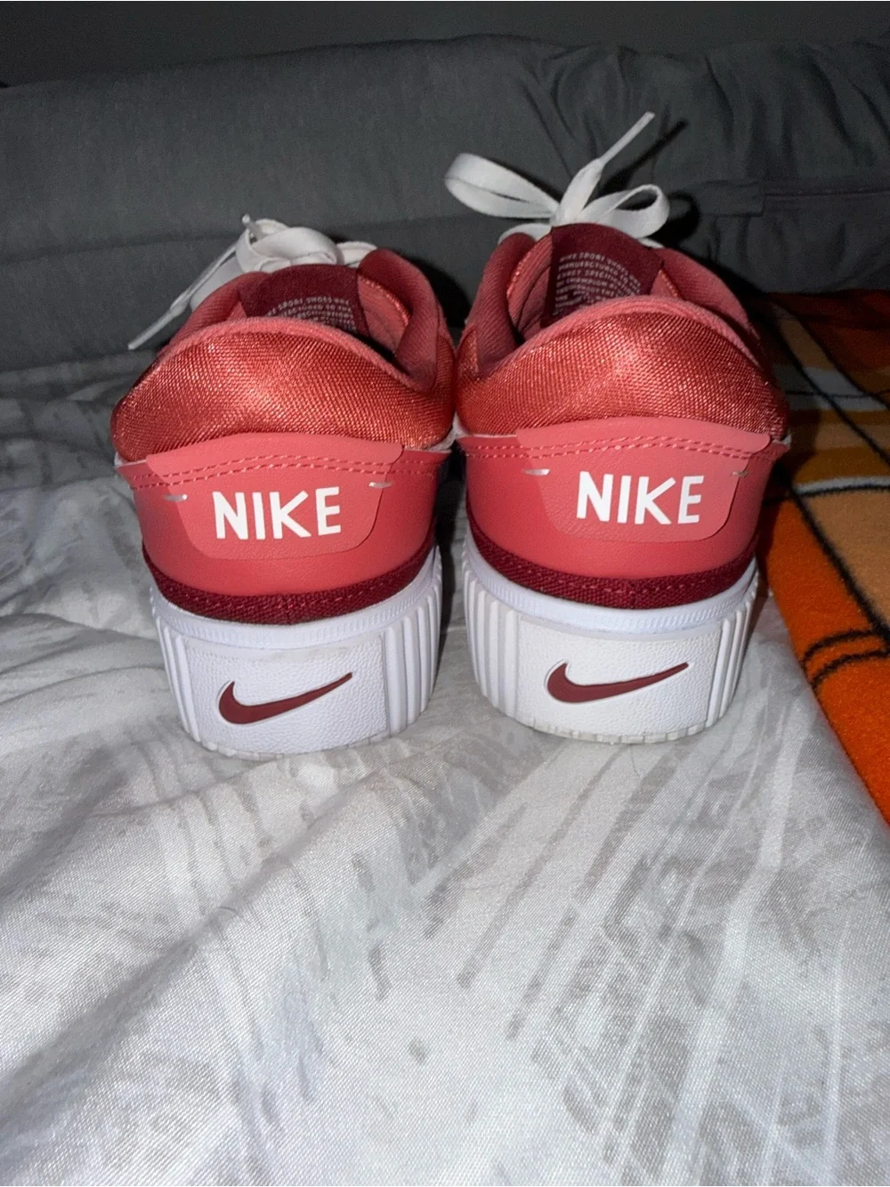 Nike Women’s Rose Pink Suede Sneakers with White Swoosh